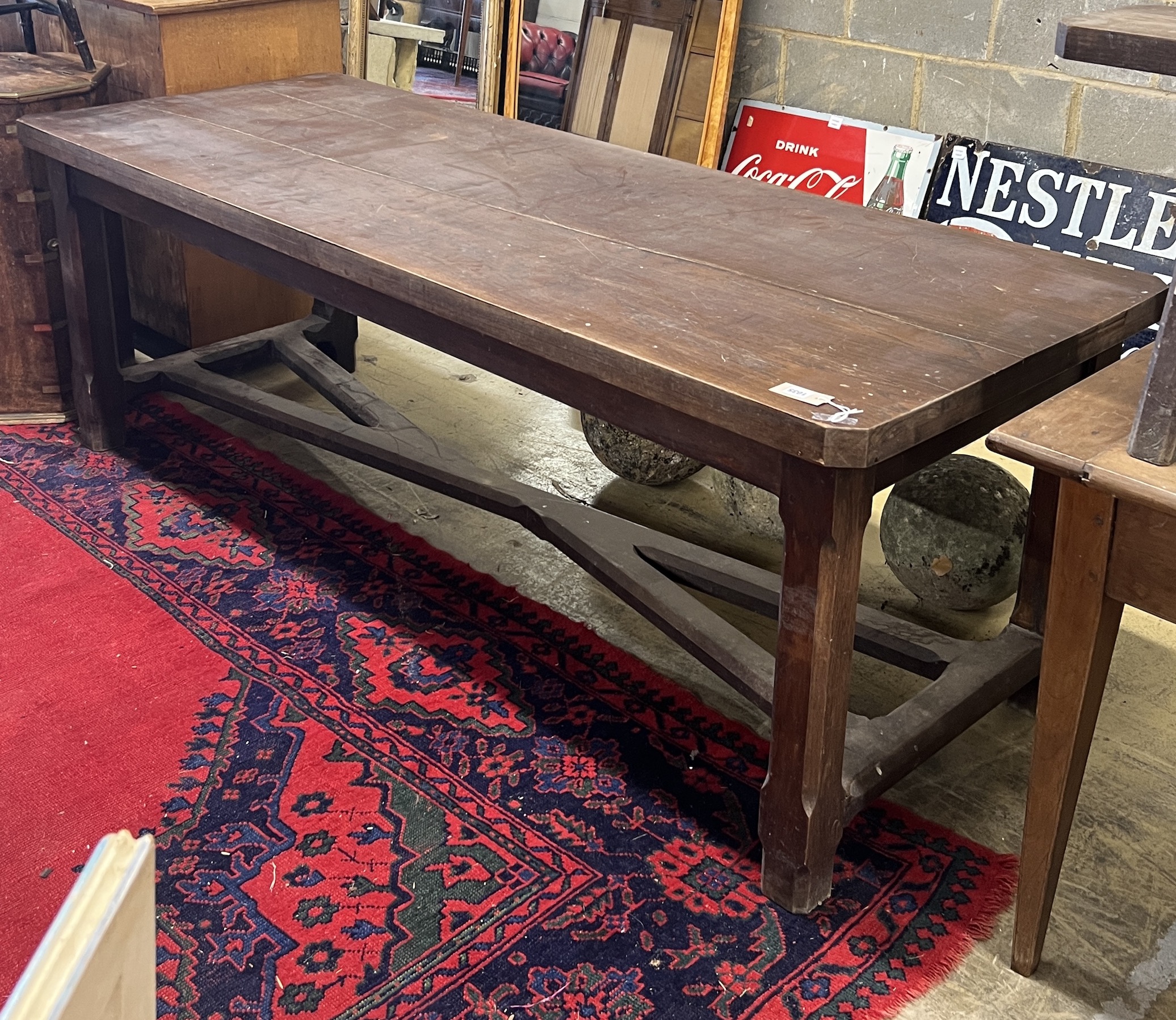 A late 19th century French oak refectory dining table with 'X' stretcher, length 210cm, width 79cm, height 73cm